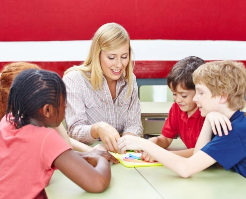 Students participating in a spring camp Vancouver classroom session focused on math and reading skills development.